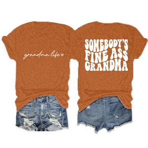 Flat lay of an orange crew neck tee with 'Somebody's Fine Ass Grandma' back print