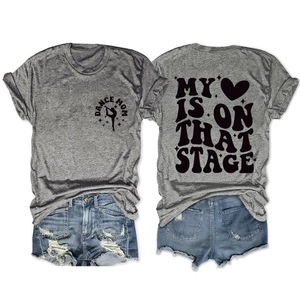 Detail of grey crewneck T-shirt with DANCE MOM print and distressed denim shorts set
