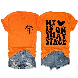 Detail view of bright orange T-shirt with MY HEART IS ON THAT STAGE back print