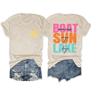 Flat lay of beige T-shirt with Boat Sun Lake back print and ripped denim shorts
