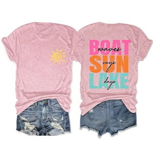 Detail of pink cotton T-shirt featuring BOAT SUN LAKE text and denim shorts set