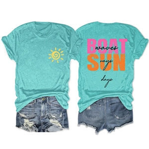 Detail of lake green t-shirt with SUN rays back print and distressed denim shorts
