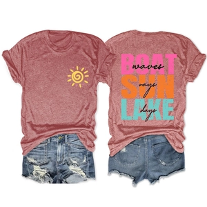 Flat lay of a red heather BOAT SUN LAKE T-shirt paired with distressed blue denim shorts