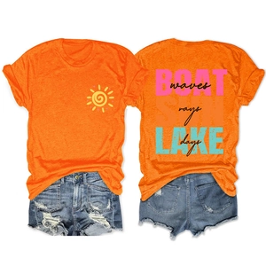 Detail of orange sun t-shirt and distressed denim shorts with boat lake waves print