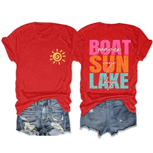 Detail of red t-shirt with LAKE days text print and blue distressed denim shorts