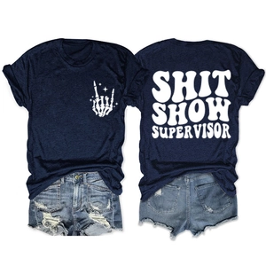 Detail of navy cotton T-shirt featuring 'SHIT SHOW SUPERVISOR' print and denim shorts