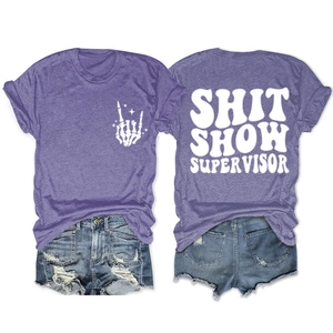 Front and back view of purple T-shirt with 'SHIT SHOW SUPERVISOR' text and denim shorts