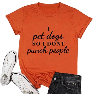 Detail of orange cotton t-shirt with I pet dogs so I dont punch people text design