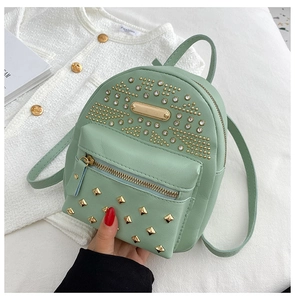 Detail of mint green mini backpack with gold rivets and rhinestones in high quality PU