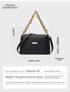 Detailed view of black quilted crossbody bag with golden chain and dimensions 22x15x7cm