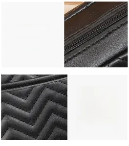 Detail of V-quilted black leather texture with durable metal zipper and tight stitching
