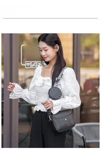 Detail of black V-quilted crossbody bag set with detachable round pouch and woven strap