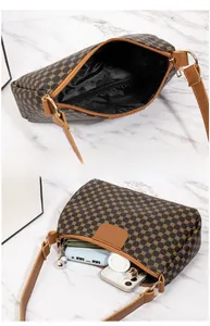 Detail view of printed crossbody bag showing spacious interior and daily storage capacity