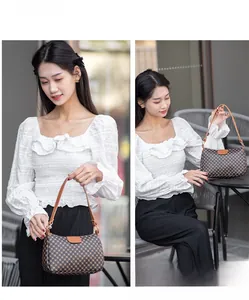 Close-up of a brown checkered pattern crossbody bag worn by a model in a street setting