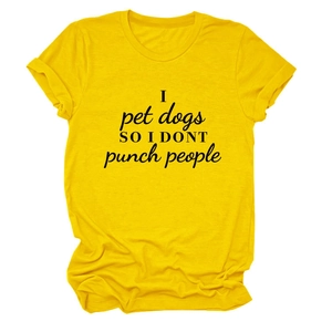 Detail of bright yellow cotton t-shirt featuring I pet dogs printed slogan