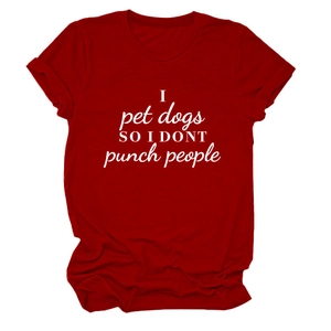 Flat lay of a red cotton T-shirt featuring 'I pet dogs' slogan with detailed fabric texture