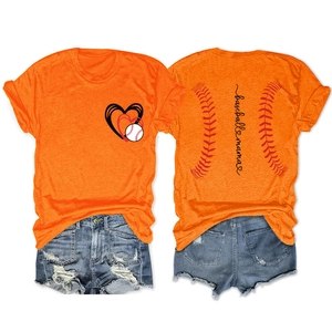 Flat lay of an orange Baseball Mama T-shirt and distressed denim shorts set
