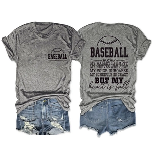 Flat lay of gray Baseball Mom T-shirt and distressed denim shorts with graphic print