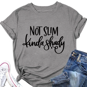 Detail of grey crewneck T-shirt showing NOT SLIM printed text and rolled sleeve cuffs