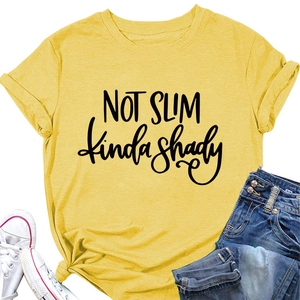 Close-up of bright yellow crew neck t-shirt with Not Slim kinda shady printed text