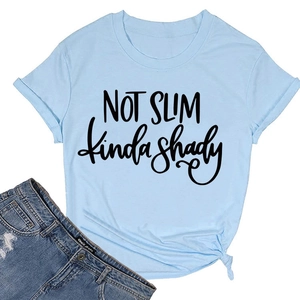Detail of light blue t-shirt featuring 'NOT SLIM' print and stylish side knot design