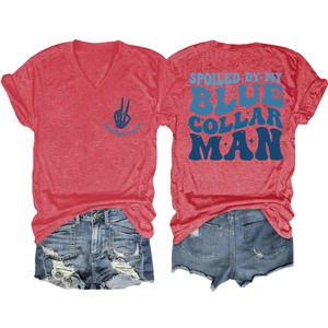 Detail of red V-neck T-shirt with Spoiled Wife print and distressed blue denim shorts