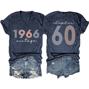 Flat lay of vintage 1966 t-shirt with Chapter 60 print and denim shorts