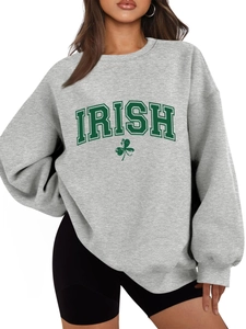 Detail shot of grey Irish sweatshirt featuring green varsity letters and shamrock print