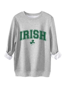 Detail of grey Irish sweatshirt featuring green clover print and thick white fleece lining