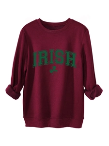 Detail of burgundy Irish shamrock sweatshirt with soft fleece lining and ribbed cuffs
