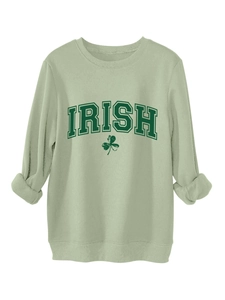 Detailed close-up of light green Irish sweatshirt with shamrock and text print
