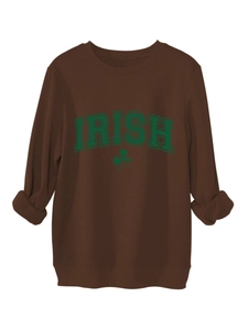 Detail view of the green Irish clover print on a brown thick warm fleece sweatshirt