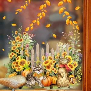 Fall window clings featuring cartoon cats, sunflowers, pumpkins, and white fence
