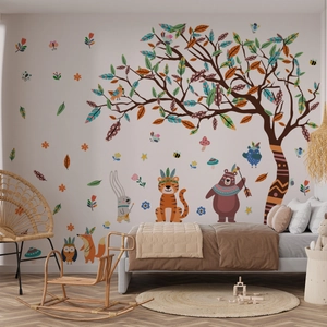 Kids wall decals featuring forest animals under a large colorful tree in a cozy nursery