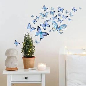Blue and purple luminous butterfly wall stickers glowing in a cozy bedroom scene