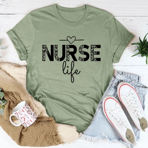 Sage green nurse life t-shirt with leopard print text styled with shorts and shoes