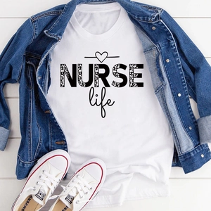 Flat lay of white nurse life graphic t-shirt styled with denim jacket and sneakers
