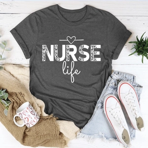 Flat lay of charcoal gray NURSE life t-shirt with leopard print and casual accessories