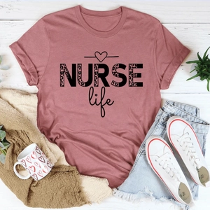 Relaxed fit Nurse Life cotton t-shirt with leopard print text on white wood background