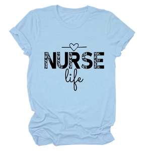 Close-up of NURSE Life leopard print lettering and heart on a blue cotton t-shirt