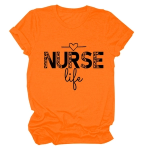 Detail of NURSE life text with leopard print pattern on orange cotton T-shirt