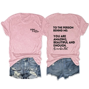 Front and back view of pink T-shirt featuring inspirational message TO THE PERSON BEHIND ME