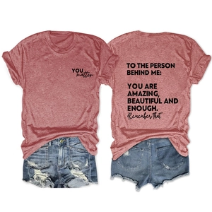 Front and back detail of a brick red tee with YOU matter print and denim shorts