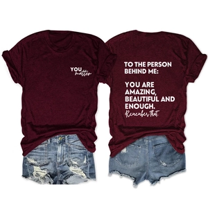 Detail of burgundy t-shirt with YOU matter print and motivational text on the back