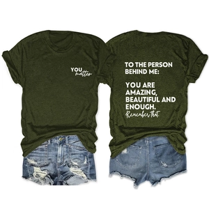 Flat lay of dark green cotton T-shirt with YOU matter print and back motivational text