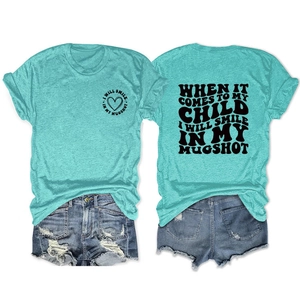 Flat lay view showing front and back of turquoise t-shirt and frayed denim shorts