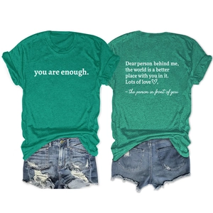 Front and back view of green 'You Are Enough' t-shirt with blue ripped denim shorts