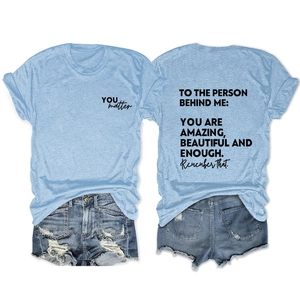 Light blue t-shirt with back quote print paired with distressed denim shorts