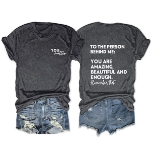 Detailed front and back views of charcoal cotton t-shirt with slogan and denim shorts