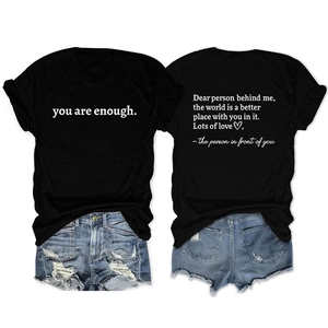 Detail of 'Dear Person Behind Me' black T-shirt showing front text and back quote design
